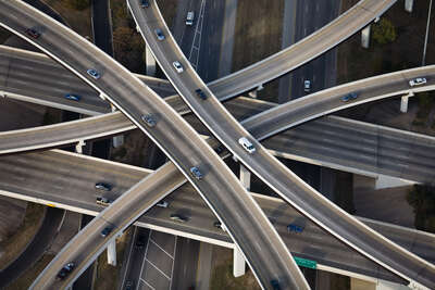  curated aerial photography : Inverted Cloverleaf interchange RT1 and RT183, Austin, Texas by Alex Maclean
