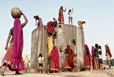   collecting water, Rajasthan by Christopher Pillitz
